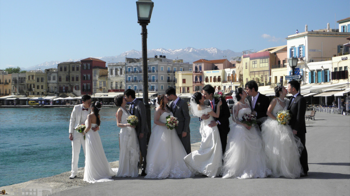 Chania: The Chinese women in their wedding dresses in the Venetian Harbour