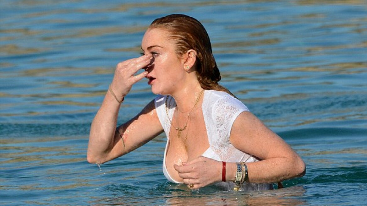 Lindsay Lohan dips in white lingerie... Where else but on Mykonos? (pics)