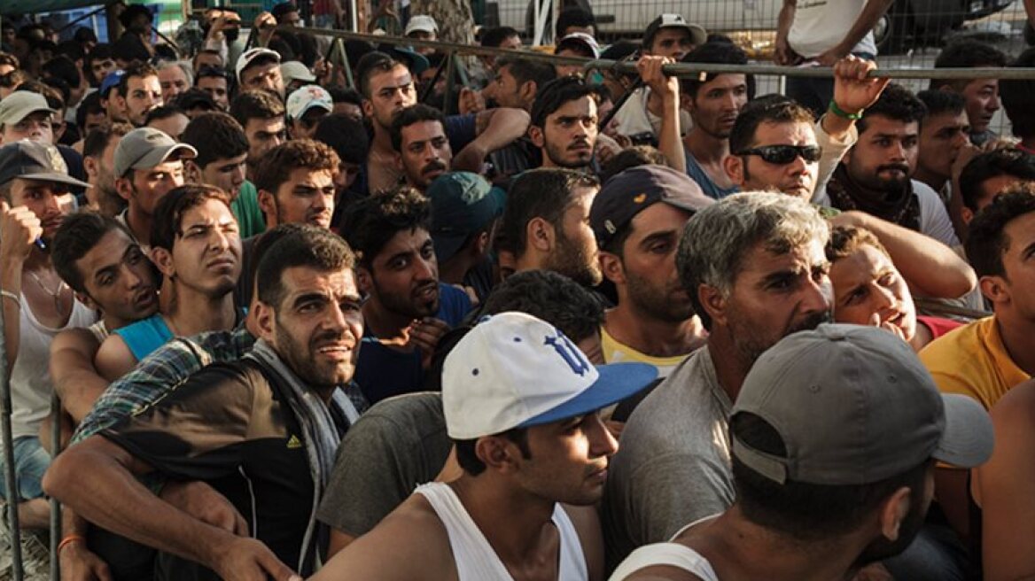 Migrants transported from isles now camped in several Athens squares
