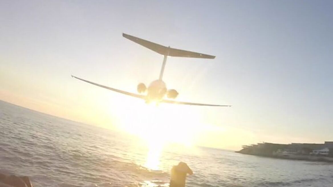 Viral video: Plane scrapes over tourists' heads!