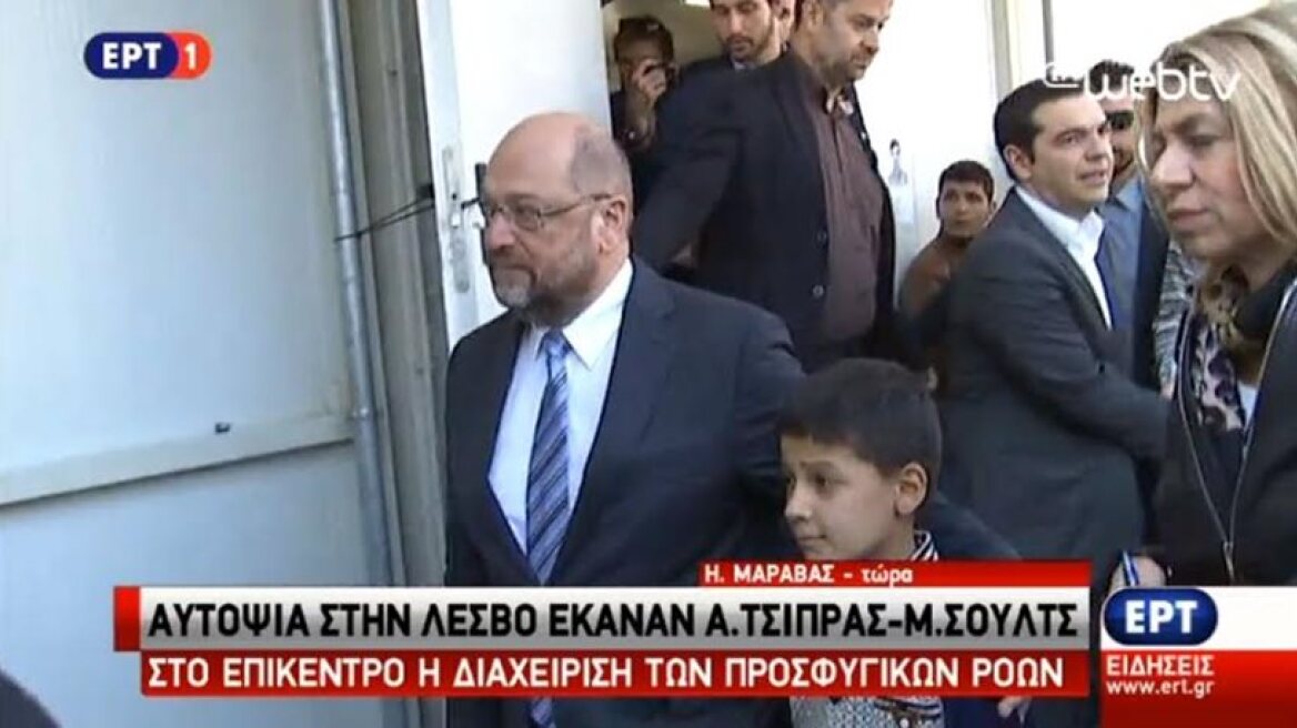 A refugee boy asks money from Schultz