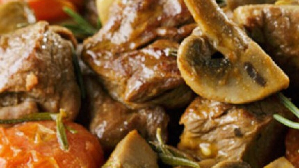 Roast lamb with mushrooms, tomato and rosemary