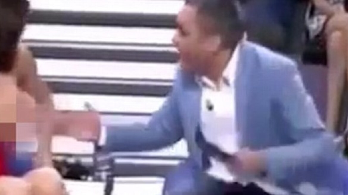 Woman has breast exposed on TV (video-photos)