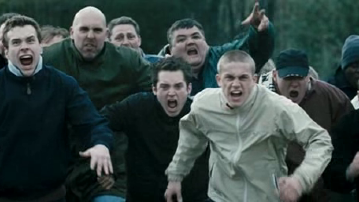 Shame! Panathinaikos hooligans bash, spit and kick Olympiakos journalist