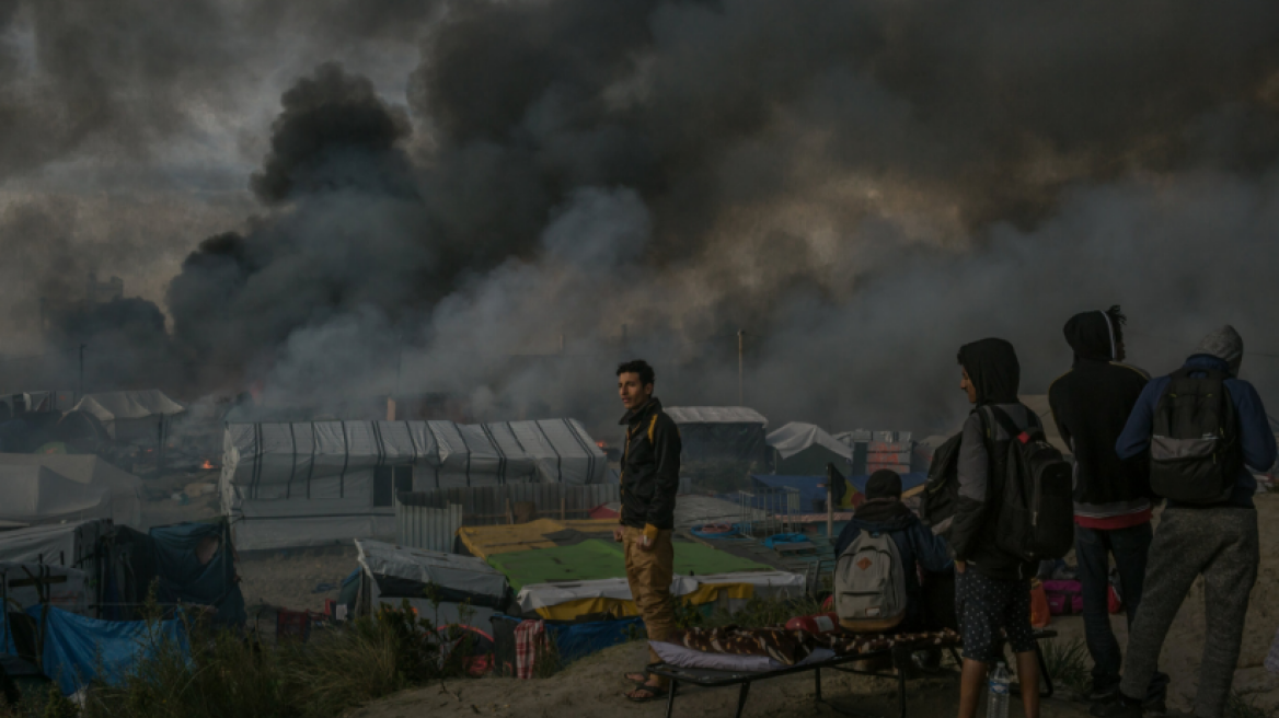 France, facing criticism, promises the bare essentials for migrants