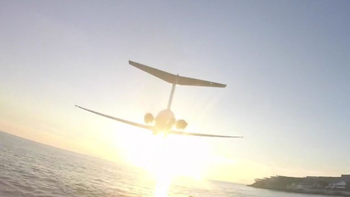 Viral video: Plane scrapes over tourists' heads!