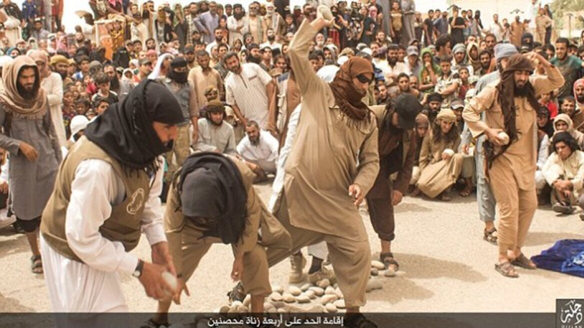 Brutal images of ISIS jihadists stoning men (photos)