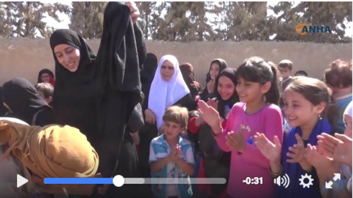 Syrian women burn burqas after ISIS leave (video)