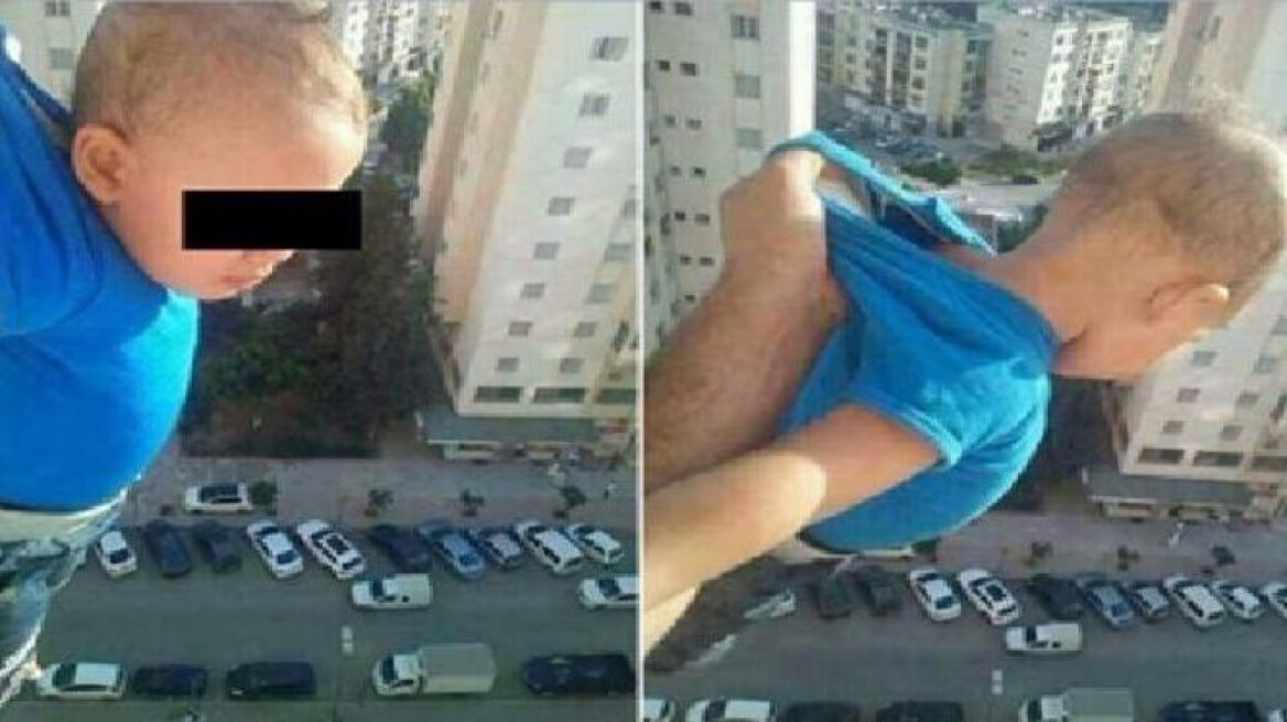 Φωτό που κόβει την ανάσα: Αλγερινός κρεμά το παιδί του στο κενό για... 1.000 likes στο Facebook!