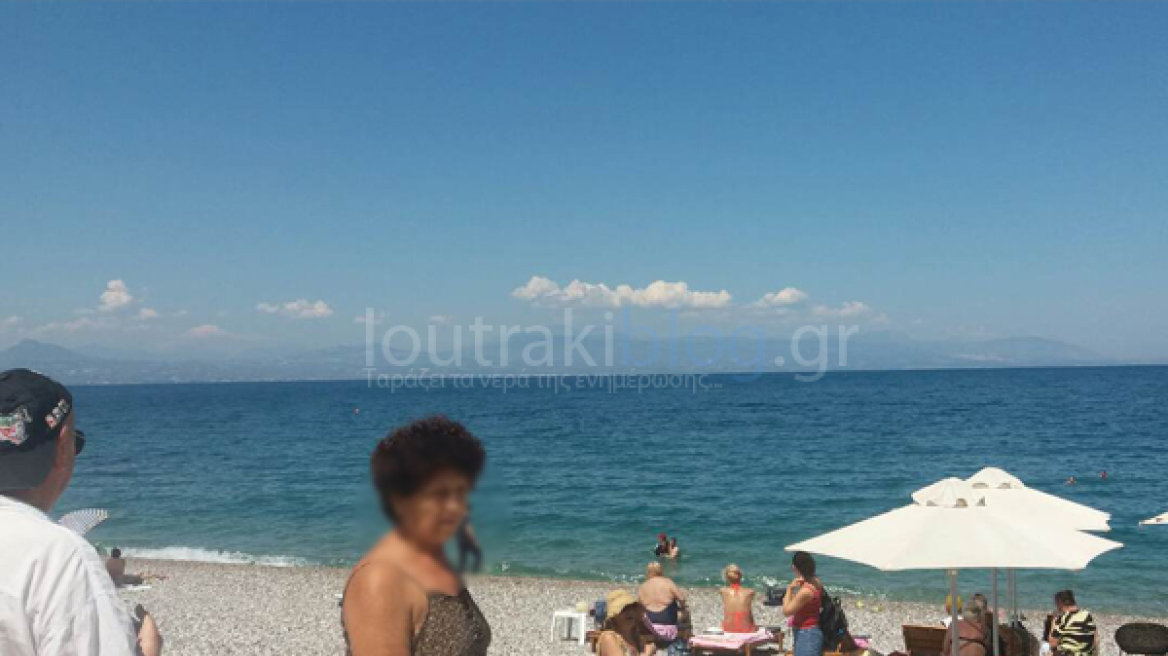 Φωτογραφίες από Λουτράκι: Μασέρ βούτηξε στην θάλασσα για να γλυτώσει την σύλληψη 
