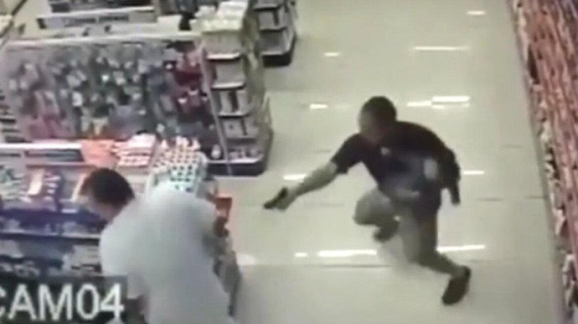 Officer shoots suspects while holding his baby boy! (shocking video)