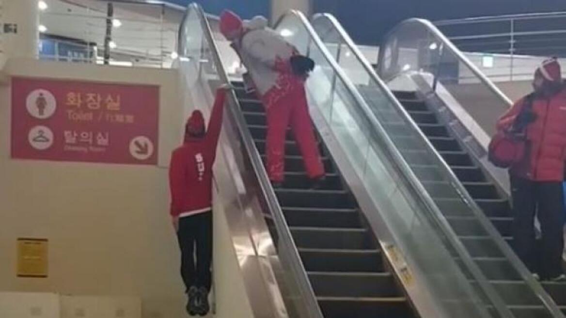 Swiss skier deserves a Gold medal for his hilarious escalator stunt (AMAZING VIDEOS)
