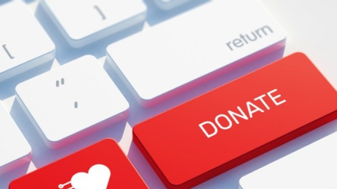 donate-icon-concept-on-the-red-keyboard-button-picture-id843289812
