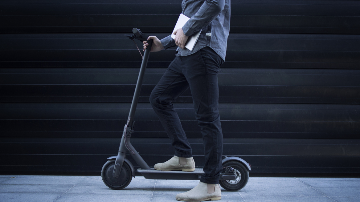 business-person-with-tablet-computer-his-electric-scooter-commuting-vehicle_2