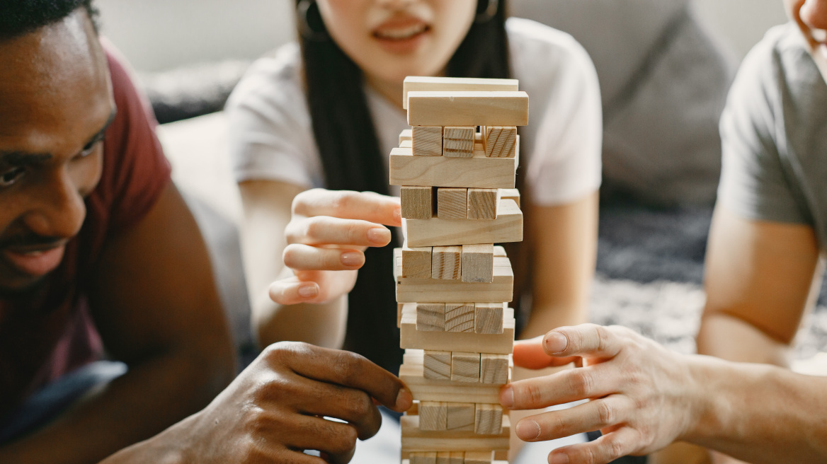 african-boy-asian-couple-playing-jenga-play-board-game-free-time-focus-game