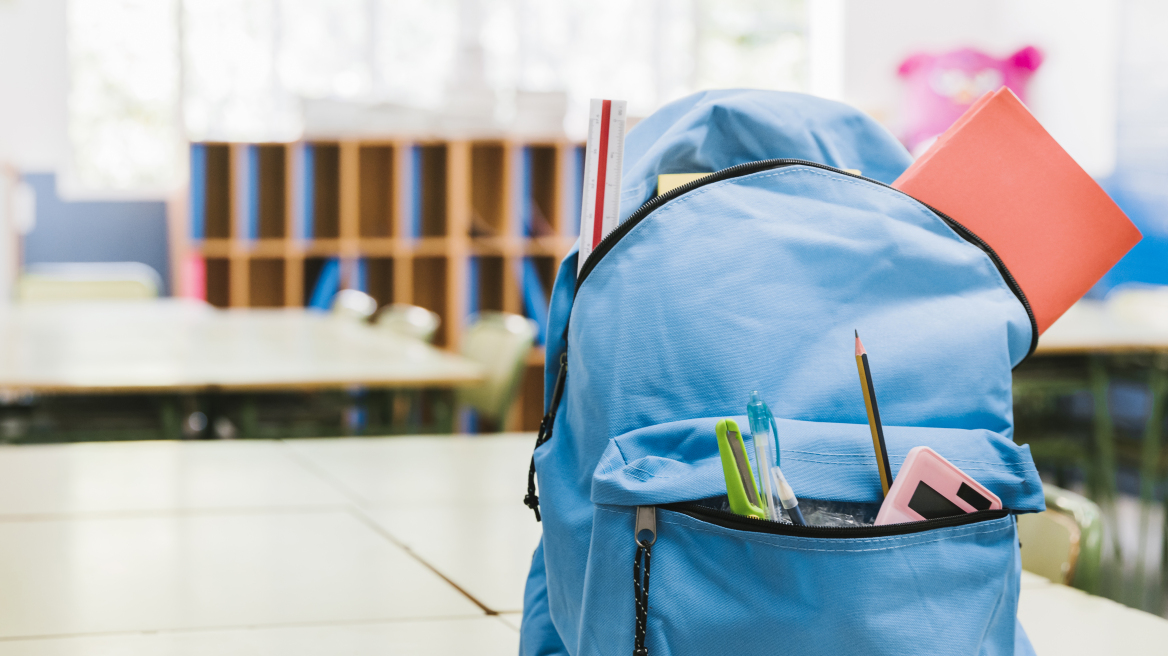 blue-schoolchild-backpack-table