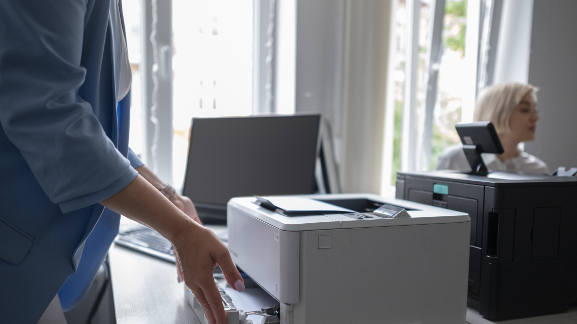 woman-using-printer-office-work