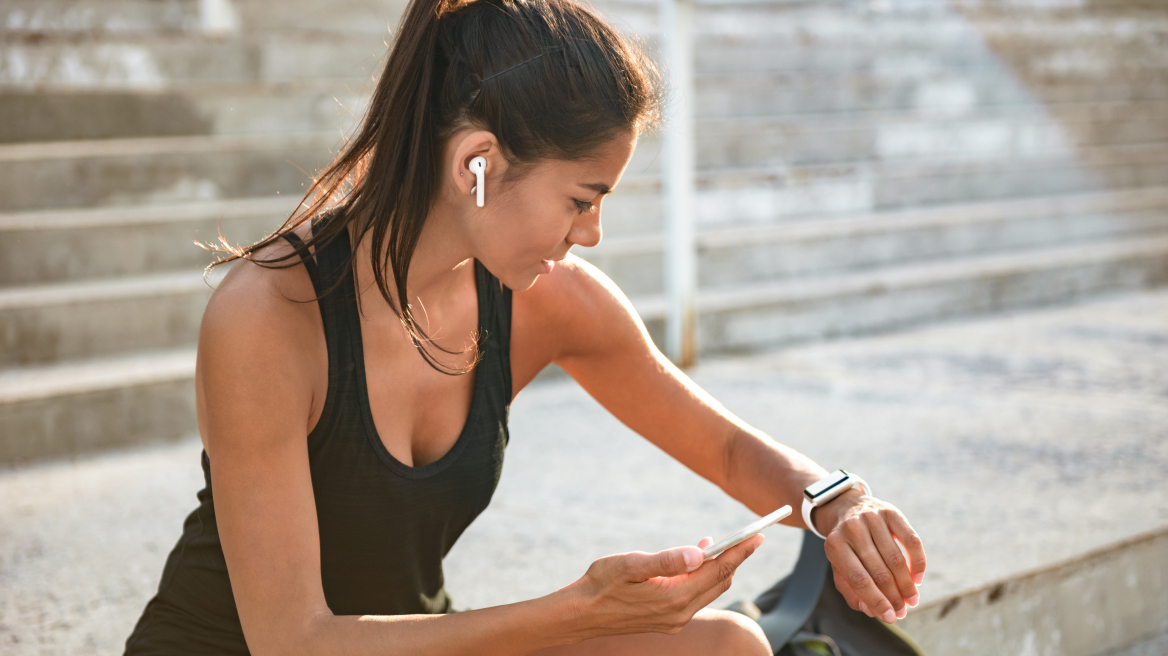 portrait-young-fitness-woman-earphones