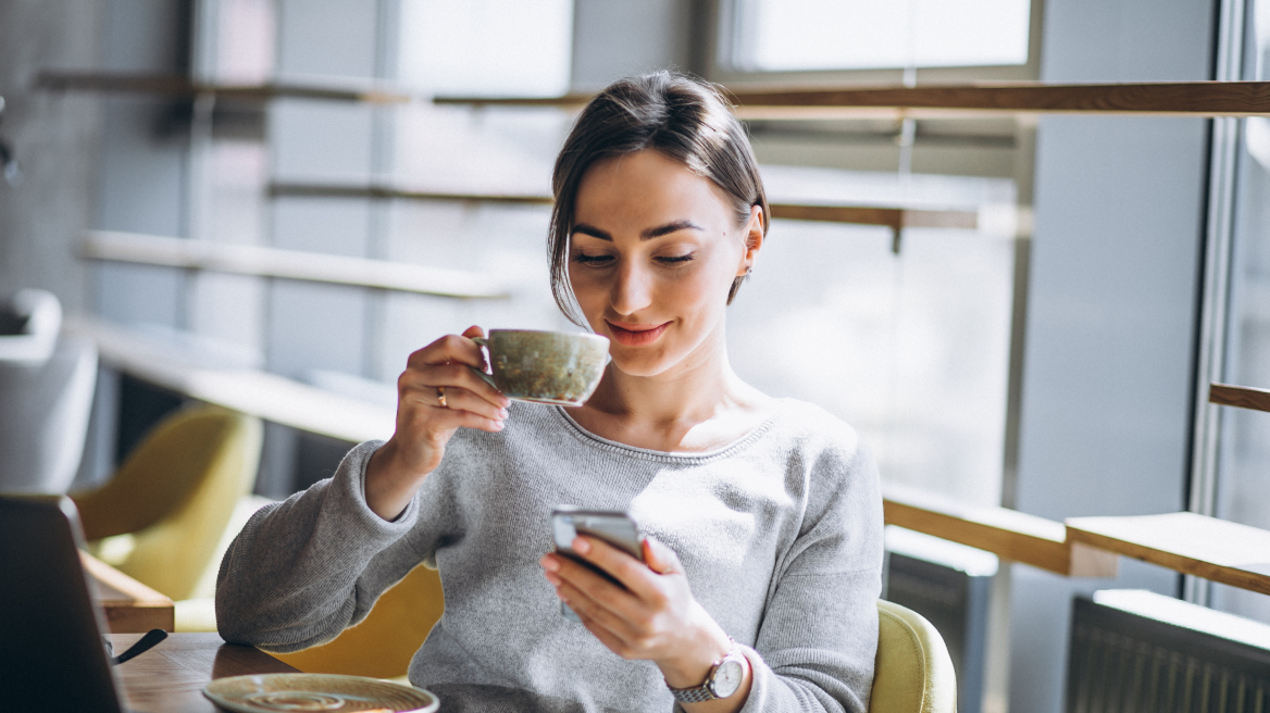 woman-sitting-cafe-drinking-coffee-working-computer__5_