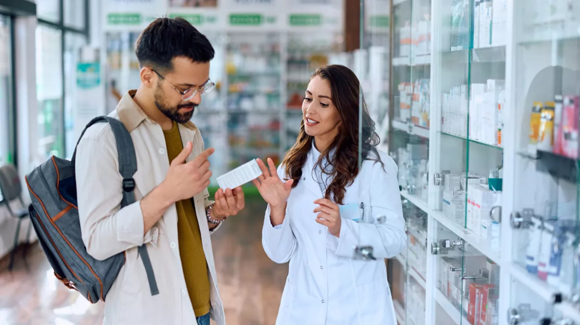 young-man-buying-medicine_shutterstock_2318055181