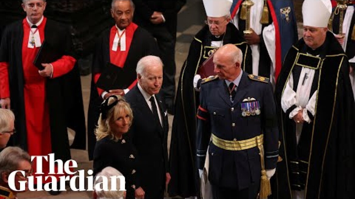 Joe Biden waits for seat after apparent late arrival at Queen’s funeral