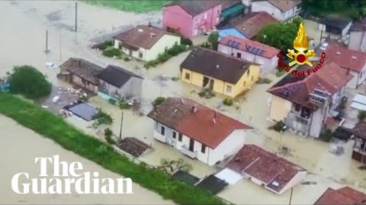 People call for help as extreme floods engulf houses and roads in Italy