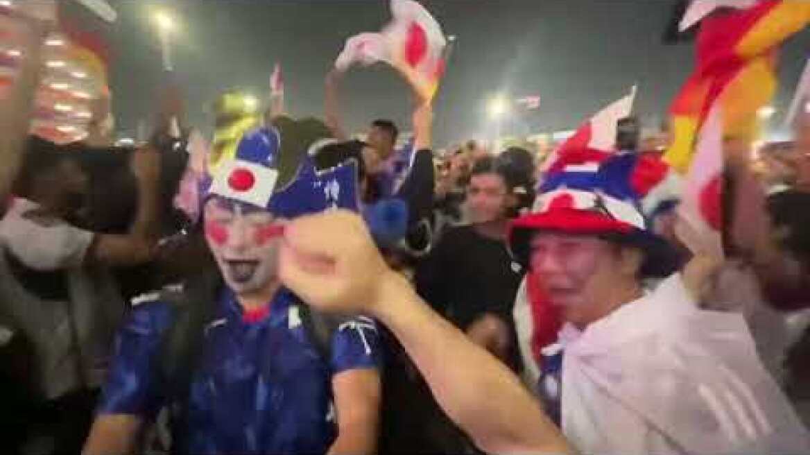 Japan fans celebrate after their team’s surprise win over Germany