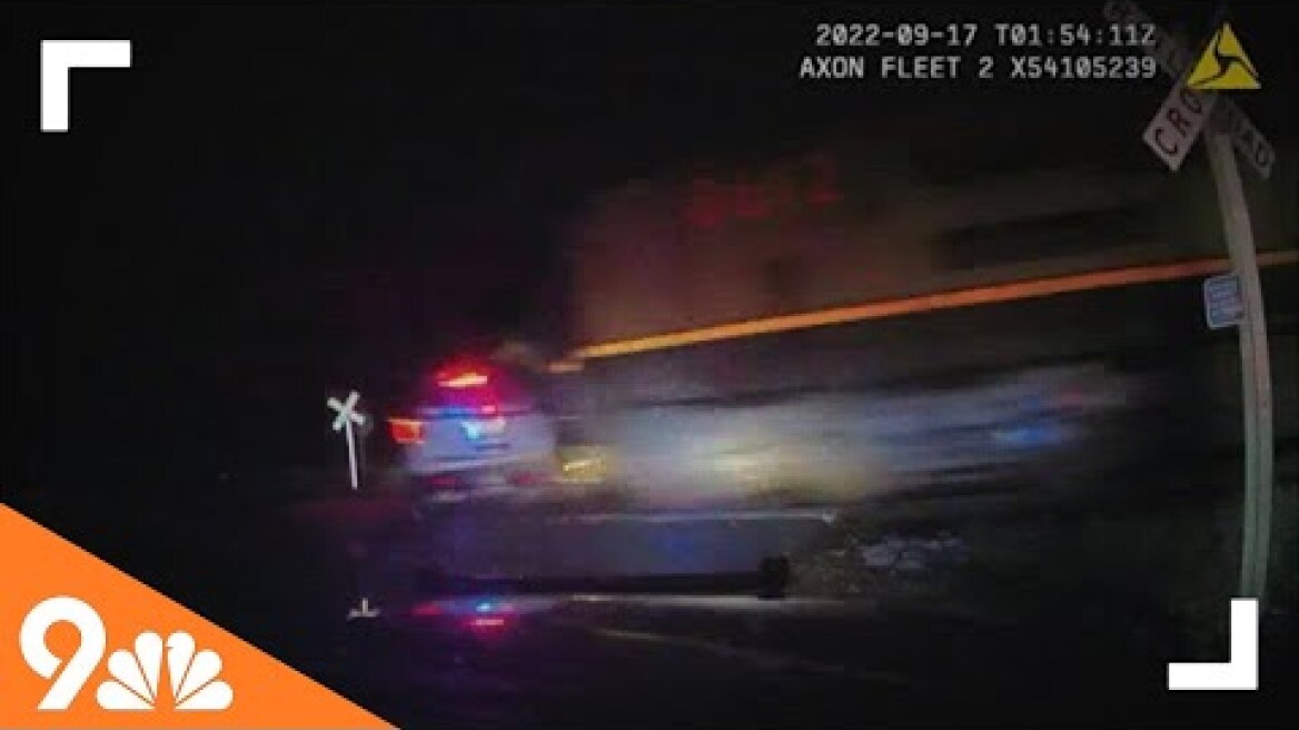 Video shows train hitting police cruiser with suspect inside