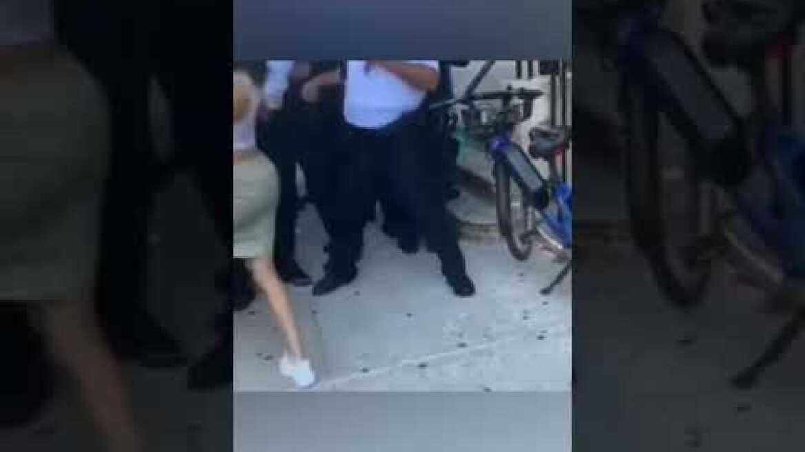 NYPD officer PUNCHES YOUNG WOMAN IN THE FACE