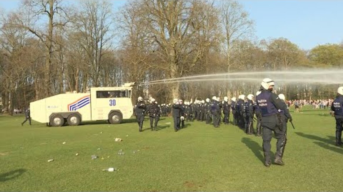 Riot police break up large crowds gathered in Brussels park for fake concert | AFP
