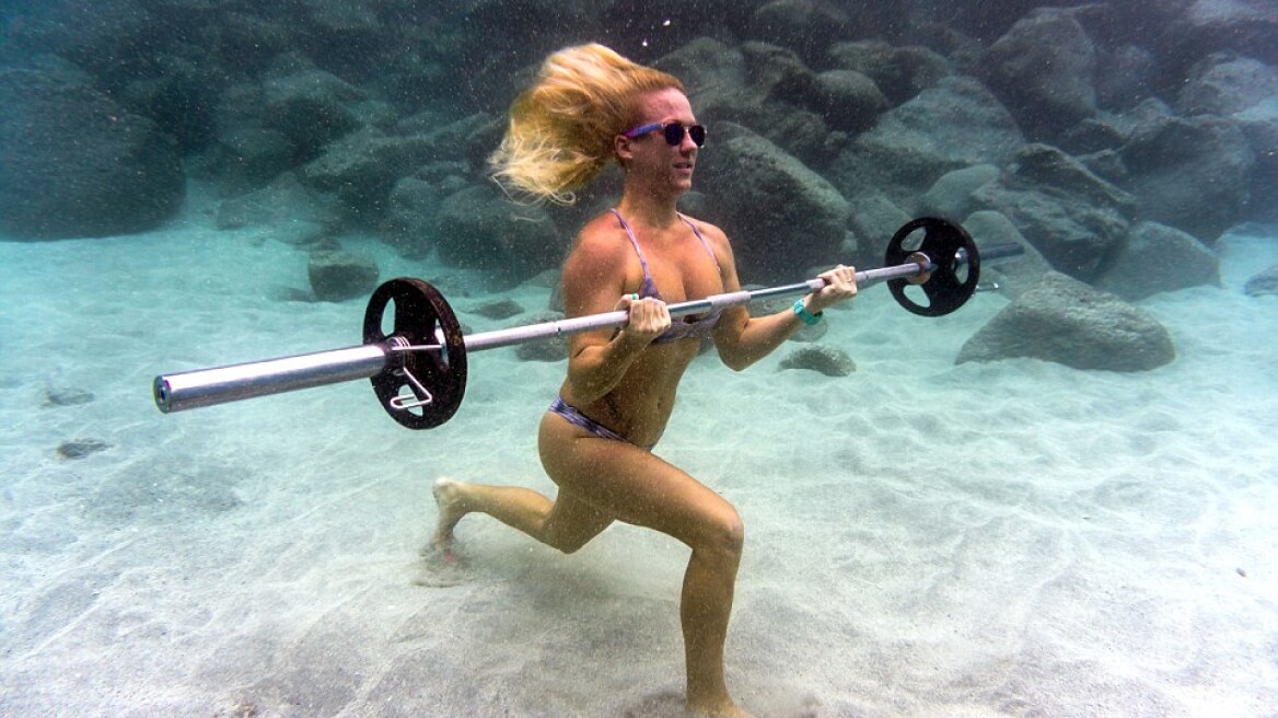 Underwater photos of a model lifting weights