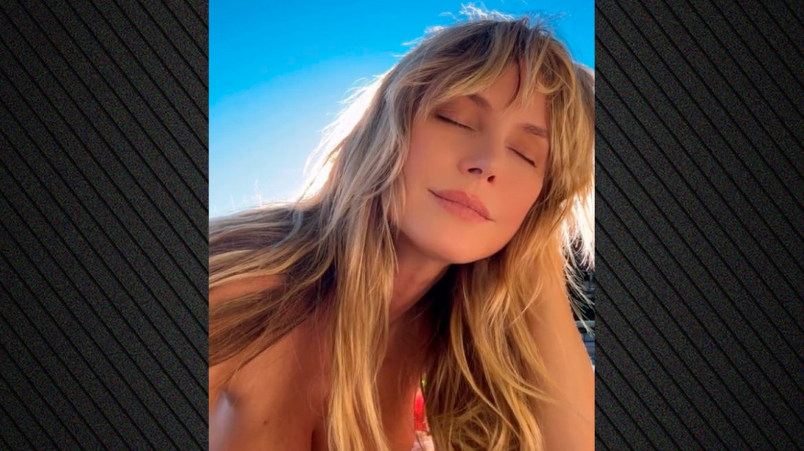 Η Χάιντι Κλουμ έβαλε «φωτιά» στη Δευτέρα με το βίντεο να κάνει τοπλες ηλιοθεραπεία στην πισίνα