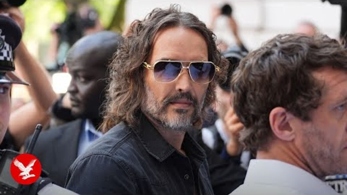 Russell Brand makes chaotic arrival at court to face rape charges