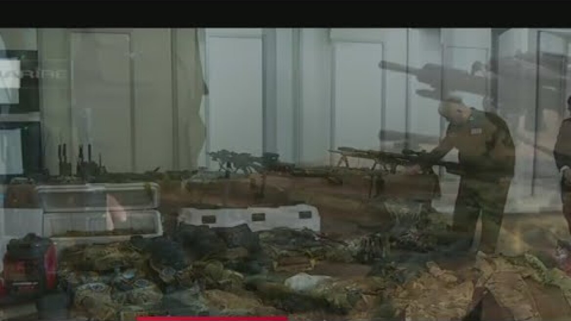 Cuban officials show alleged weapons found on boat shot