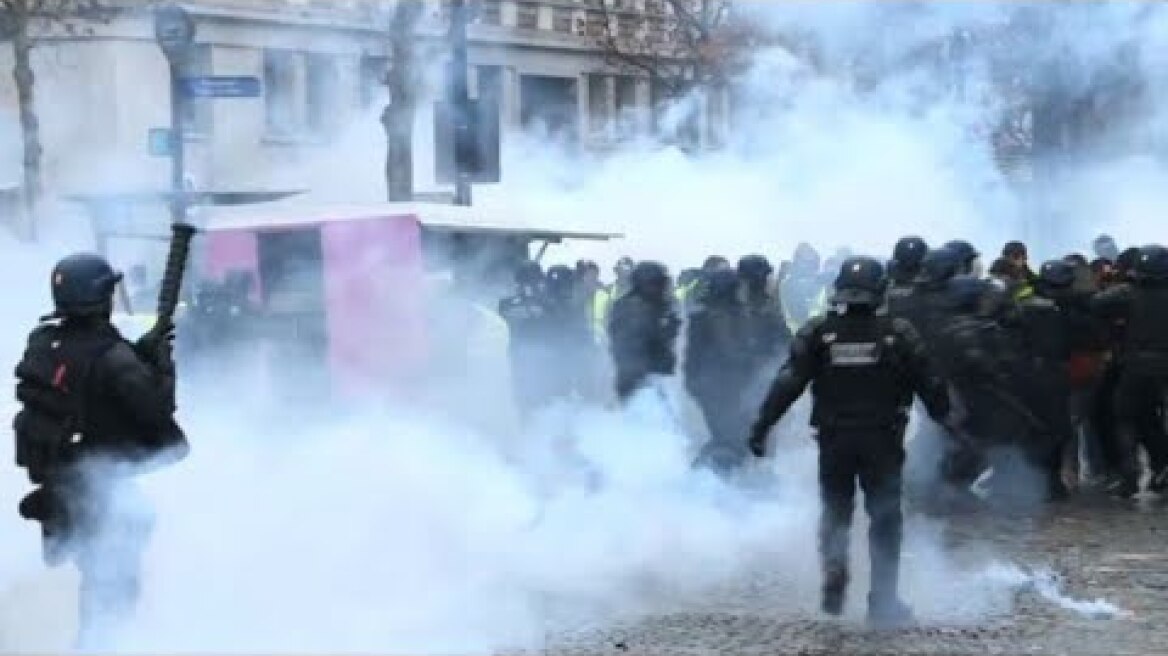 Riot police fire tear gas at 'yellow vest' protesters in Paris