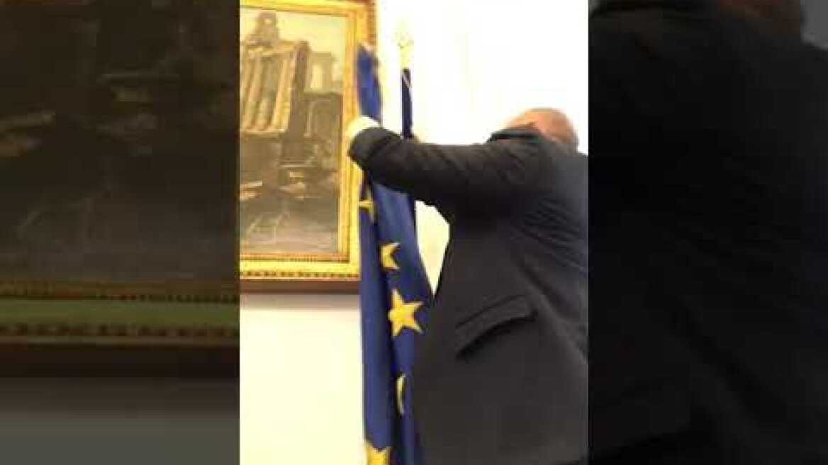 Italian politician Fabio Rampelli removes the EU flag