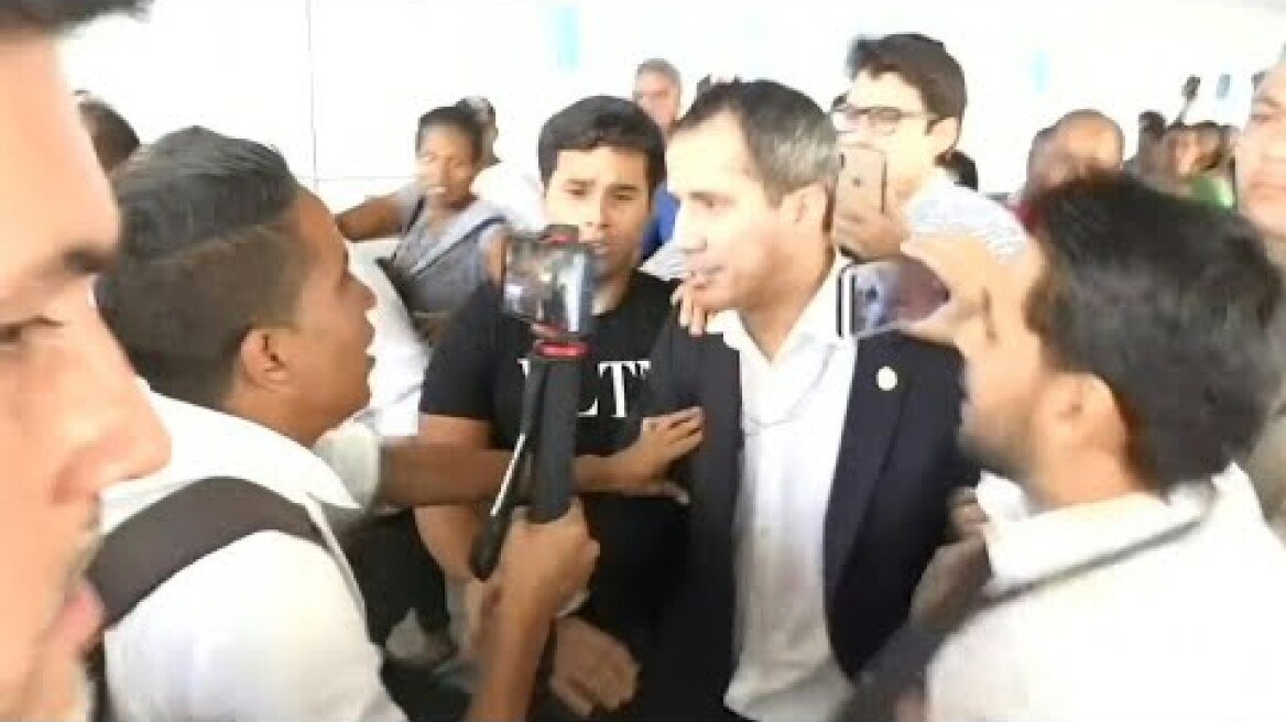 Opposition leader Guaido arrives in Venezuela after international tour | AFP
