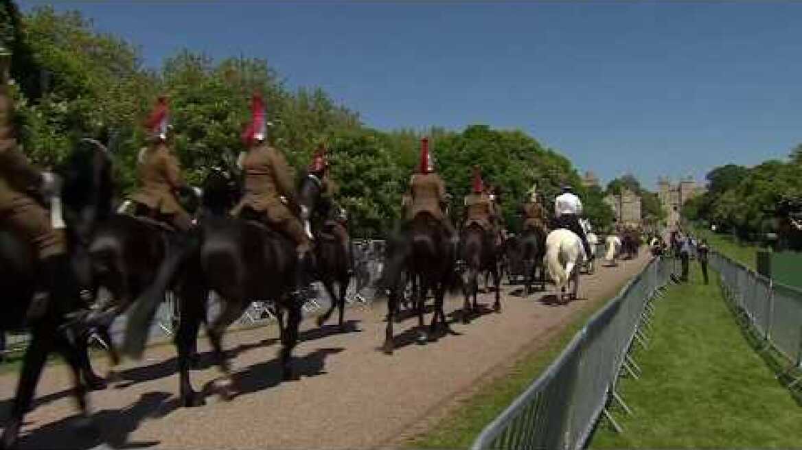 Carriage procession approaches Windsor Castle during full dress rehearsal for Royal Wedding