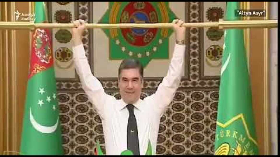 President of Turkmenistan lifts golden weights bar before his applauding Cabinet