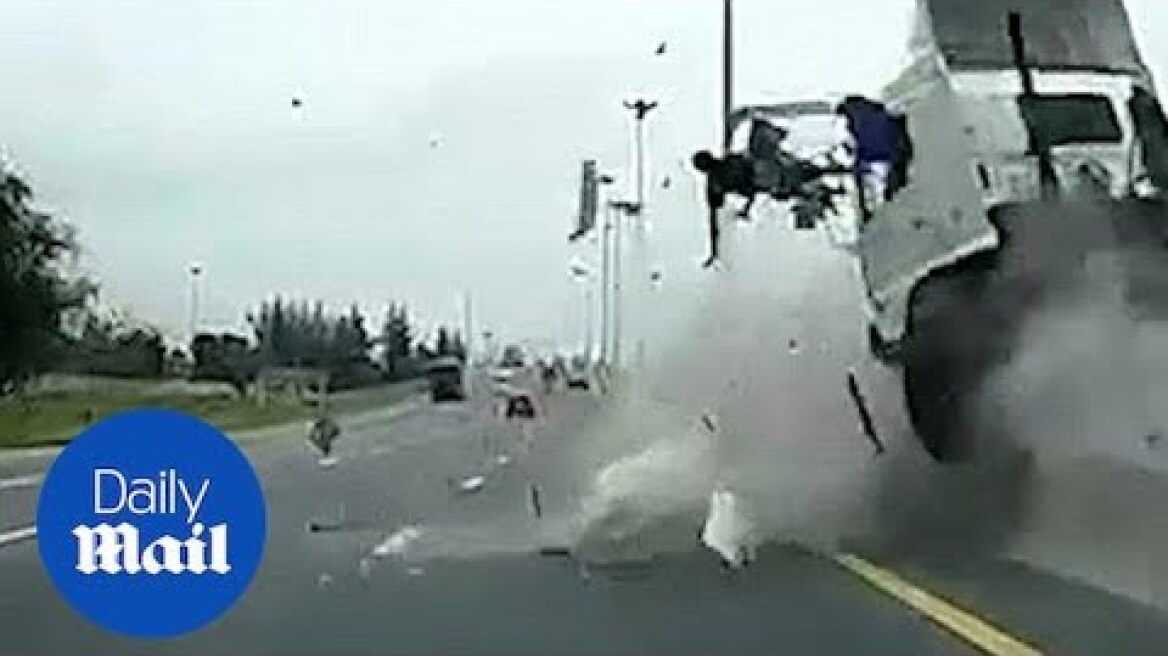 Terrifying moment truck driver hurled through the air in crash - Daily Mail