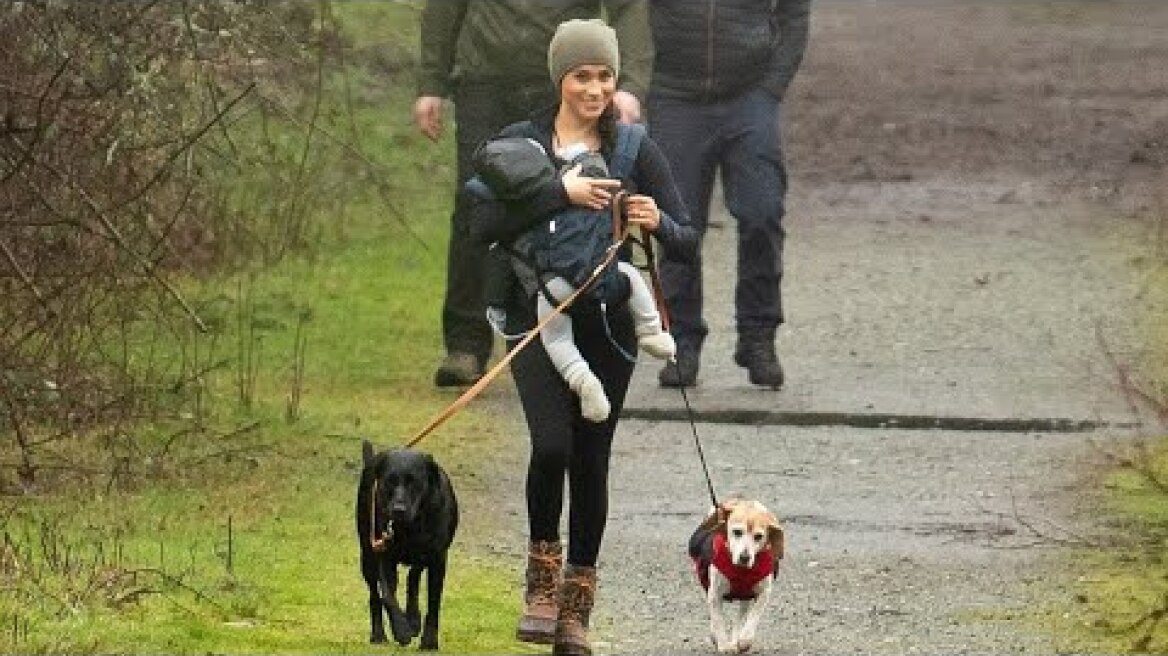 Meghan Markle beams carrying Archie and walking her dogs in Horth Hill Regional Park
