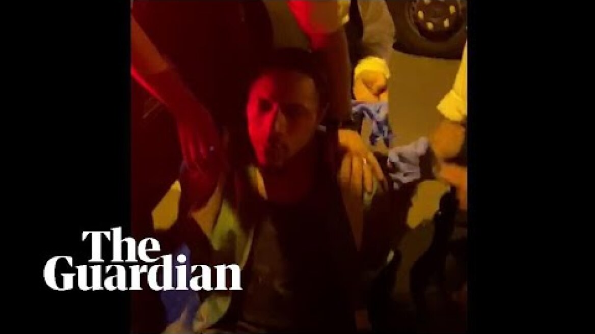 Video shows police 'kick and pepper-spray' black man handcuffed on the ground