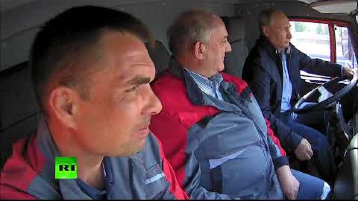 RAW: Putin drives truck across newly-opened Crimean bridge
