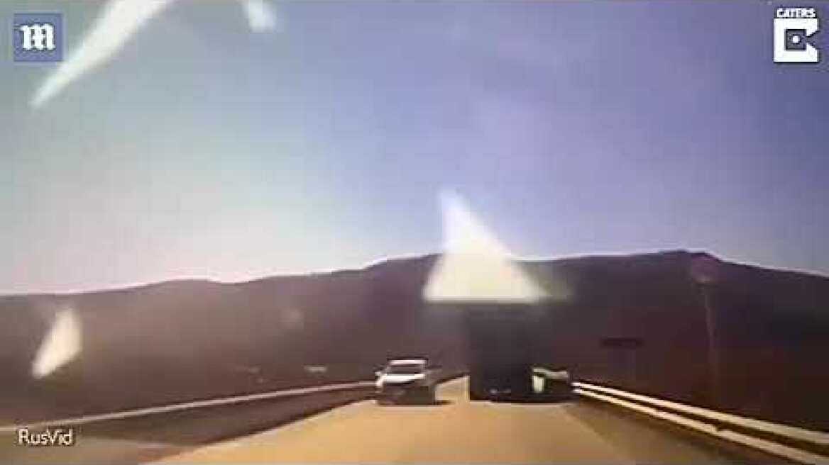 Terrifying moment car plunges into holes as bridge collapses in front of it