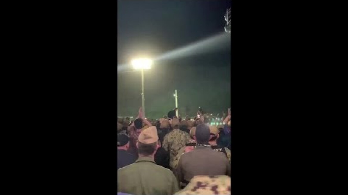 Sailors cheer fired Navy Captain Brett Crozier from USS Theodore Roosevelt