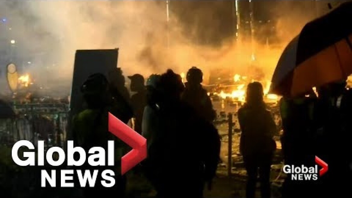 Hong Kong police threaten to use live bullets as clashes with protesters continue
