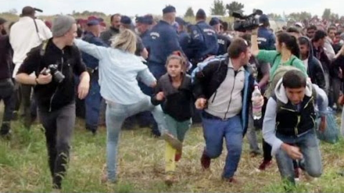 Hungarian camerawoman trips, kicks migrant