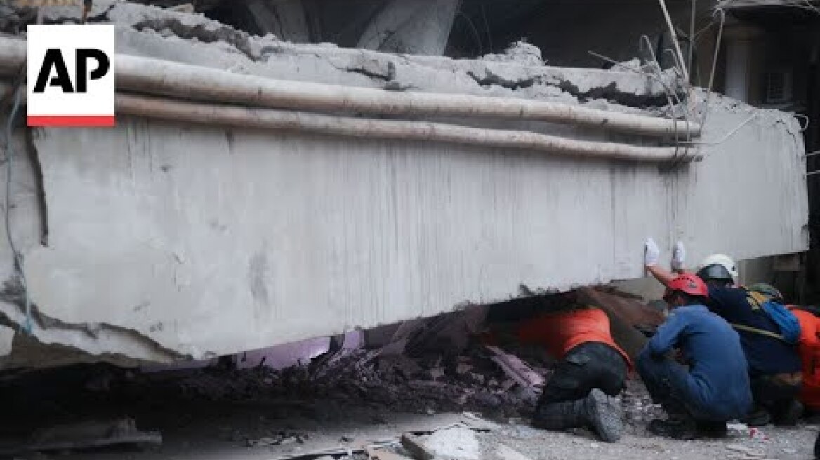 At least 91 still buried in rubble two days after Indonesian school collapse