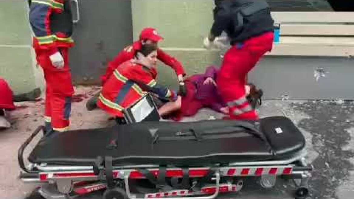 after selling in kharkiv a brave medic stays with wounded woman  as first Russian missile attack