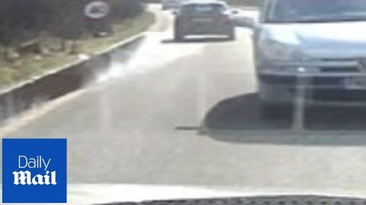 Heart-stopping moment car is hit head-on by speeding vehicle - Daily Mail